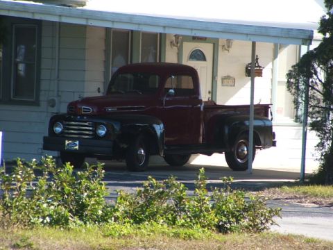 1966 Ford Ranchero - This vintage pickup truck, likely from the late 1940s, is parked under a carport.