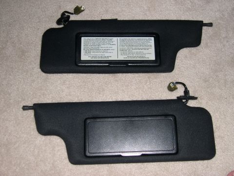 1997 Ford Probe - Pair of car sun visors, one includes an air bag warning label.