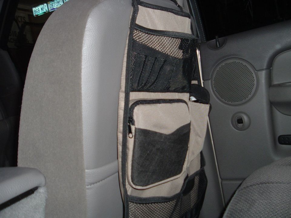 Interior organizer attached to seat back with multiple pockets