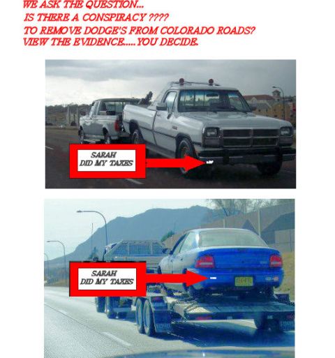 2002 Ford Crown Victoria - The image displays two trucks and a car being transported on a trailer, with red boxes highlighting the vehicles.