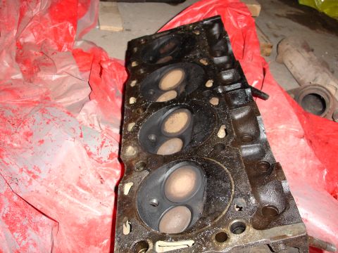 1979 Ford F-150 - A close-up view of an engine cylinder head, showing its internal components and wear.