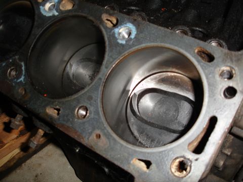 1979 Ford F-150 - Close-up view of an engine block's cylinders and pistons, indicating internal wear and some corrosion.