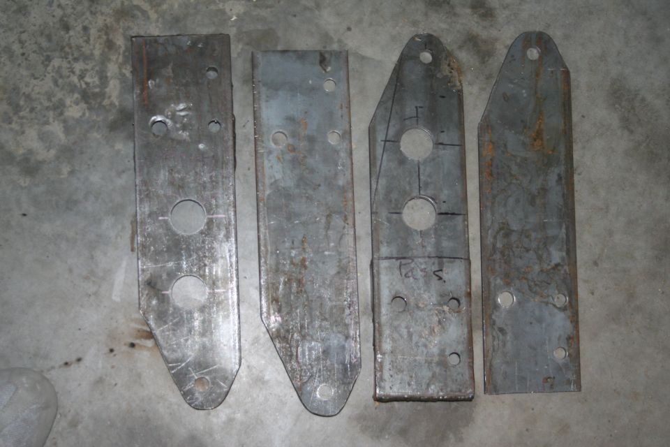 These are the front plates for the front shackle reversal. They, along with the hangers, provide for 6" of lift.
The two larger holes are for the crossmember tubes that will run from the outside plate, through the inside, across and through the other inner plate, to the outside again.