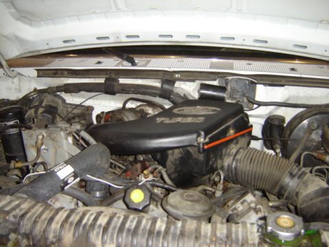 1992 Ford Bronco - Close-up view of the engine bay in a 1992 Ford Bronco, highlighting the turbo system.