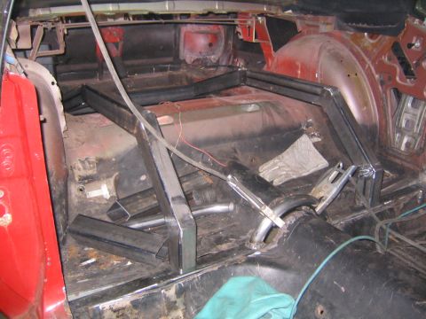 1969 Ford Mustang - Custom metal fabrication is underway inside this vehicle's interior, with roll cage components being installed.