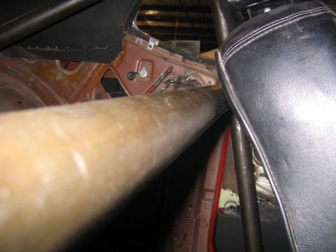 1969 Ford Mustang - Close-up of the interior, showing a roll cage and a black seat, with visible text from Supermotors.net.