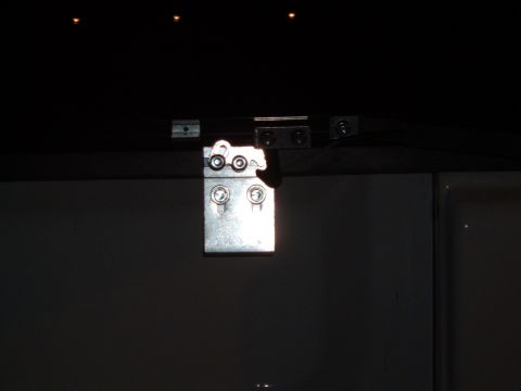 2003 Ford F-150 - Metal hinge detail, likely from a truck bed cover or tailgate.