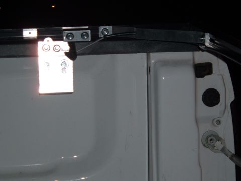 2003 Ford F-150 - The image shows the attachment points for a tonneau cover on the side of a truck bed.