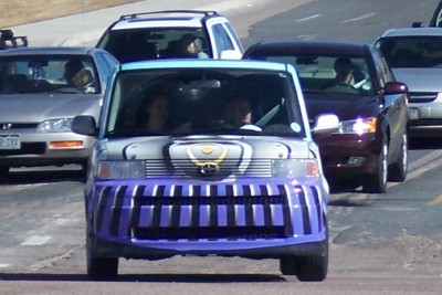 1972 Ford Ranchero - A uniquely customized Scion xB is seen driving in traffic with its distinctive purple and silver front end.