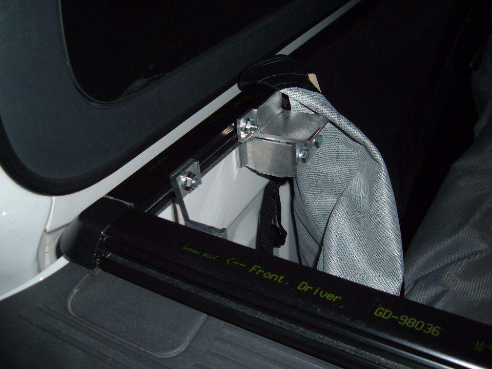 Tonneau cover hardware mounted on truck bed rail