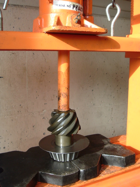 1989 Ford Bronco - Hydraulic press with a gear and bearing. Serial number is visible on the press.