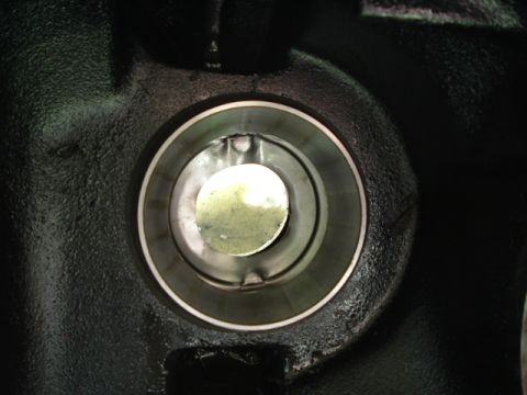 1989 Ford Bronco - Interior view of a vehicle's differential housing, showing a bearing race and internal mechanism.