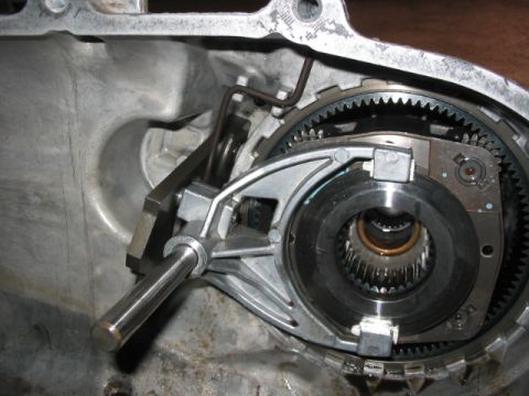 1995 Ford Bronco - Internal components of a vehicle's transfer case, including gears and a shift fork.