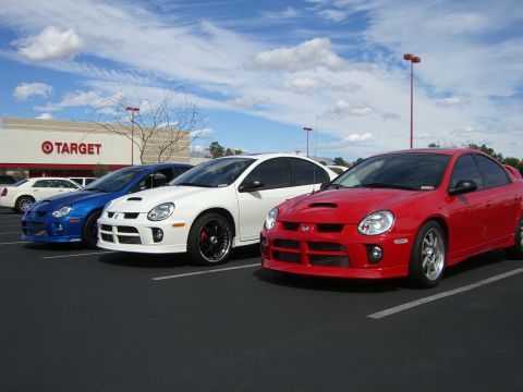 1996 Ford Probe - Three Dodge Neon SRT-4s are parked in a lot in front of a Target store.