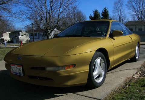 1997 Ford Probe - This 1997 Ford Probe is shown in a front 3/4 view, a gold exterior and a visible license plate.