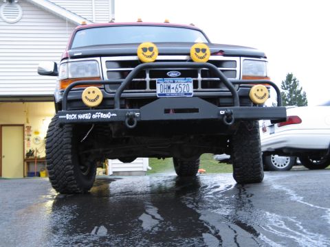 1995 Ford Bronco - This 1995 Ford Bronco features a custom front bumper with auxiliary lights and a "Buck Naked Offroad" decal.