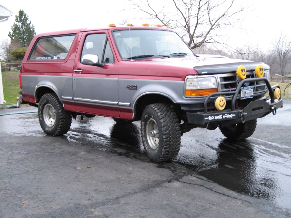 1995 Ford Bronco with aftermarket bumper and smiley face lights