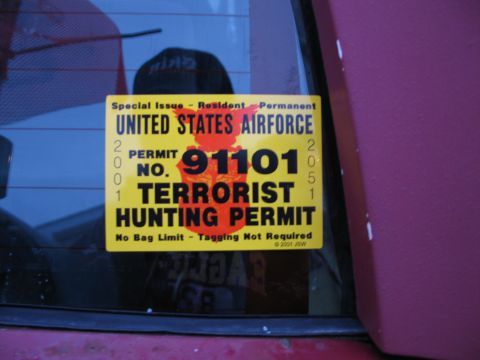 1995 Ford Bronco - A humorous sticker is affixed to the rear window of a vehicle.