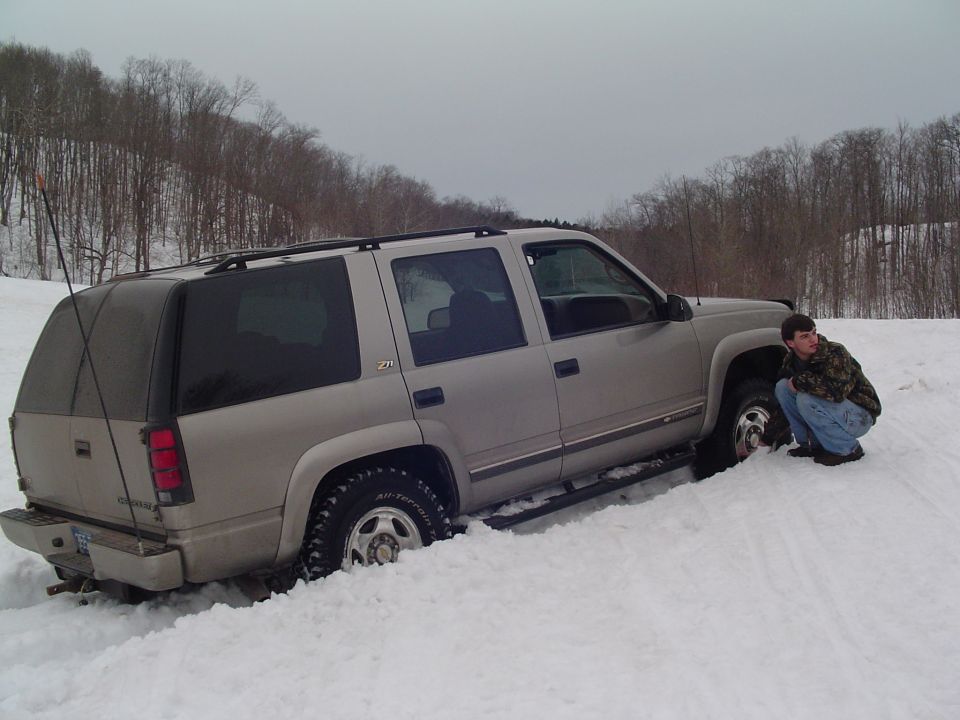 Silver SUV stuck in snow, 2000 model year