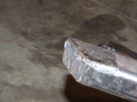 1986 Ford Bronco - Close-up of a custom metal rock slider, showing fabrication details and a website watermark.