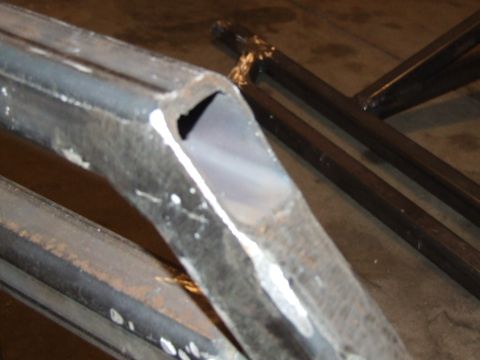 1986 Ford Bronco - Close-up of cut metal tubing, likely a custom part, with a website watermark visible.