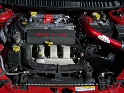 1996 Ford Probe - Close-up of a Dodge Neon SRT-4 engine bay, showing the SRT-4 engine cover and intake system.