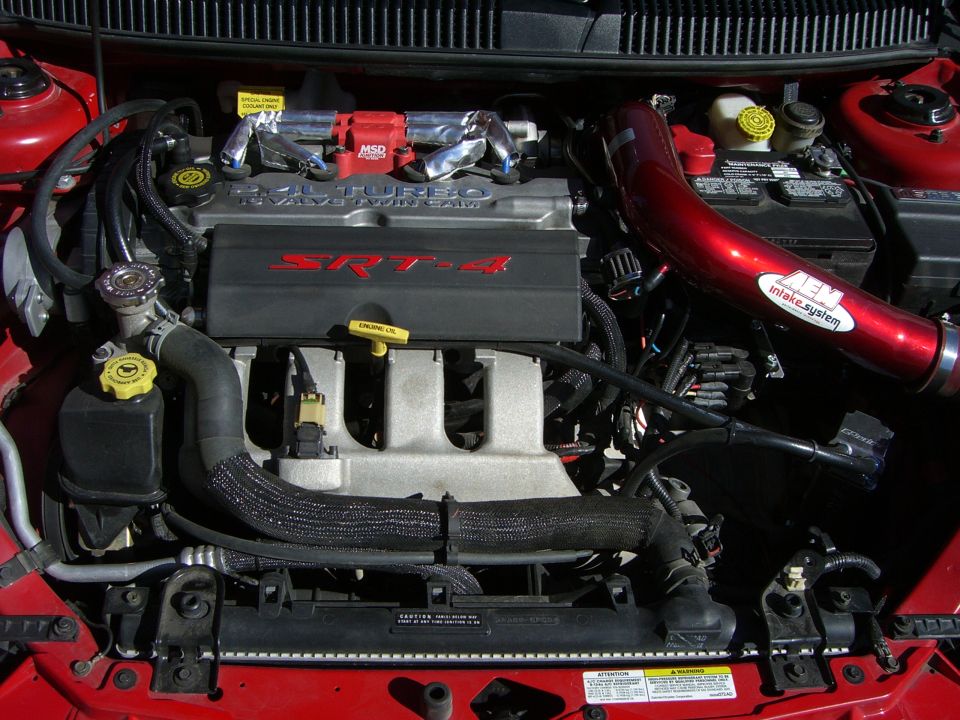 Dodge Neon SRT-4 engine bay with red AEM intake and SRT-4 engine cover