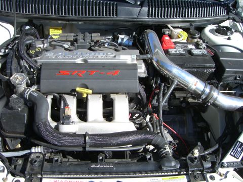 1996 Ford Probe - The engine bay of a Dodge Neon SRT-4, its turbocharged engine and custom intake.