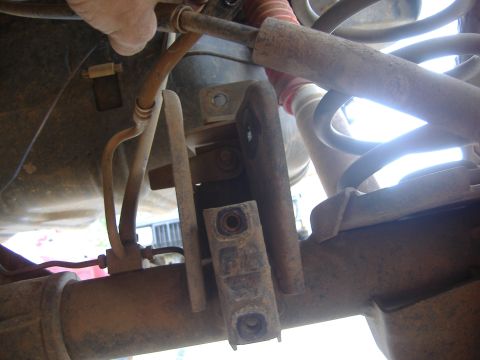 2004 Jeep Wrangler - Underside view of vehicle suspension components and brake lines.