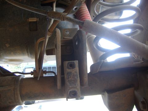 2004 Jeep Wrangler - This image shows the underside of a vehicle, focusing on the rear axle and suspension system components.