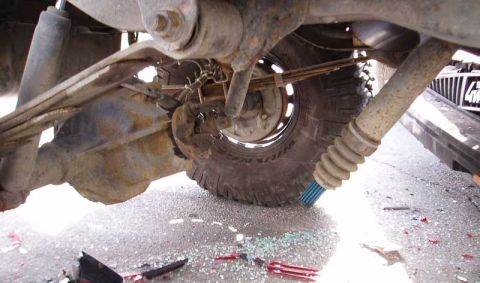1996 Ford Bronco - Well, axle wrap got the best of me. Broke the yoke eyes off the output shaft. U-joint is unscathed. Spicer U-joints are truly strong.