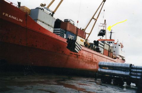 1986 Ford Bronco - Here's the crane slinging her off the container and down to its new Arctic home.