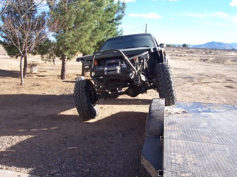 1981 Ford F-150 - This heavily modified truck features a custom roll cage and winch, suggesting it's built for off-road use.