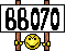 1992 Ford Bronco - A sign displaying the number 66070 with a cartoon smiley face attached below.