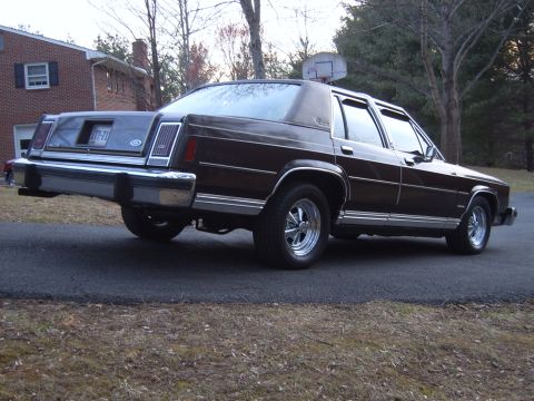 1982 Ford Crown Victoria LTD - Dark brown 1980s Ford sedan with aftermarket Cragar SS wheels is parked on a driveway.