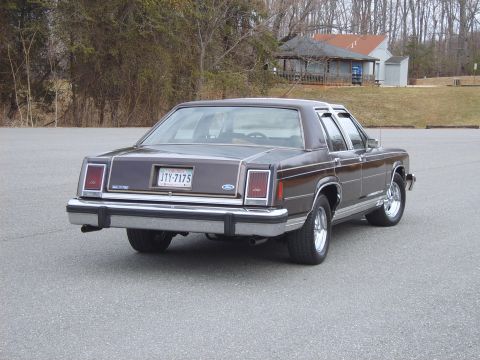 1982 Ford Crown Victoria LTD - Rear view of a 1982 Ford Crown Victoria LTD, showing its distinctive body style and aftermarket Cragar SS wheels.