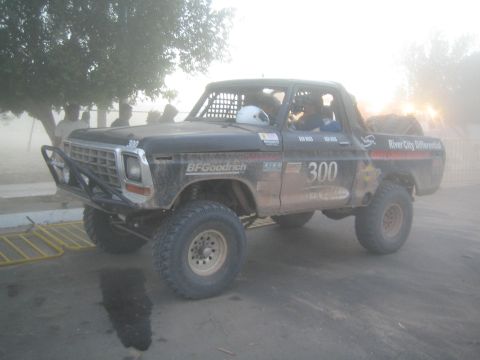 1990 Ford Bronco - black vintage Ford pickup off-road race truck, number 300, with BFGoodrich and River City Differential decals.