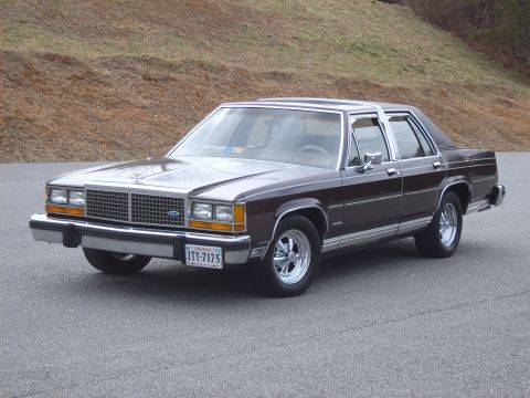 1982 Ford Crown Victoria LTD - This 1982 Ford Crown Victoria LTD features a two-tone brown and silver paint scheme and aftermarket Cragar SS wheels.