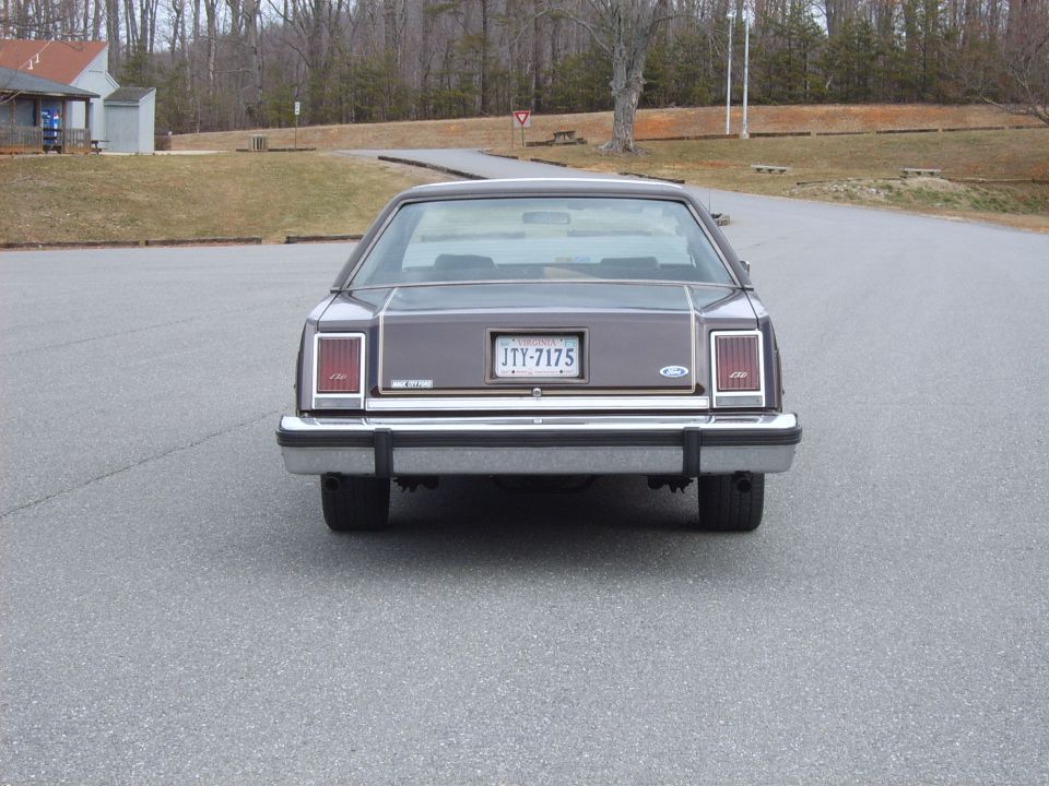 Gray two-door coupe rear with Virginia plate JTY-7175 in a parking lot
