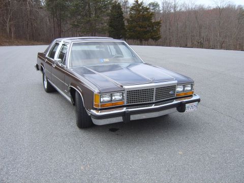 1982 Ford Crown Victoria LTD - This 1980s Ford sedan features a prominent chrome grille and aftermarket Cragar SS wheels.