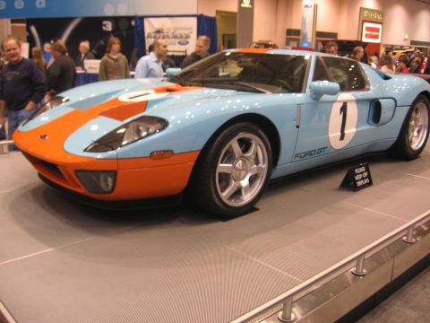 1999 Ford Crown Victoria - Ford GT race car with Gulf livery on display at an auto show.