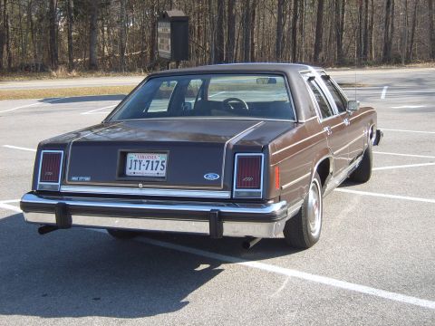 1982 Ford Crown Victoria LTD - Rear view of a 1982 Ford Crown Victoria LTD showing its distinctive taillights and chrome bumper.