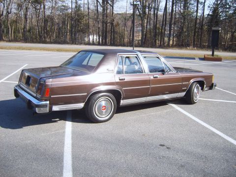 1982 Ford Crown Victoria LTD - This sedan's boxy styling and chrome trim are characteristic of 1980s American sedans.