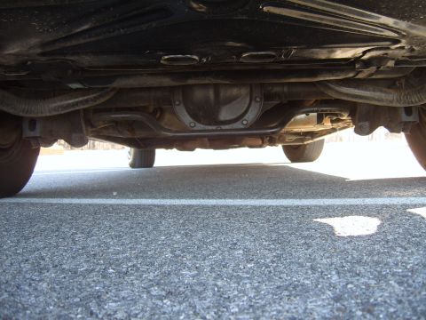 1982 Ford Crown Victoria LTD - Underside view of a car, focusing on the rear differential and suspension.