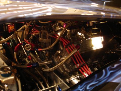 1981 Ford Mustang - Close-up view of a modified engine bay, highlighting custom parts and wiring.