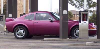 1972 Ford Ranchero - This purple coupe, possibly a 1972 Ford Ranchero, is seen from the side.