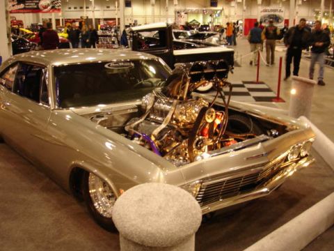 1981 Ford Mustang - This heavily modified 1965 Chevrolet Impala features a polished engine and custom wheels.