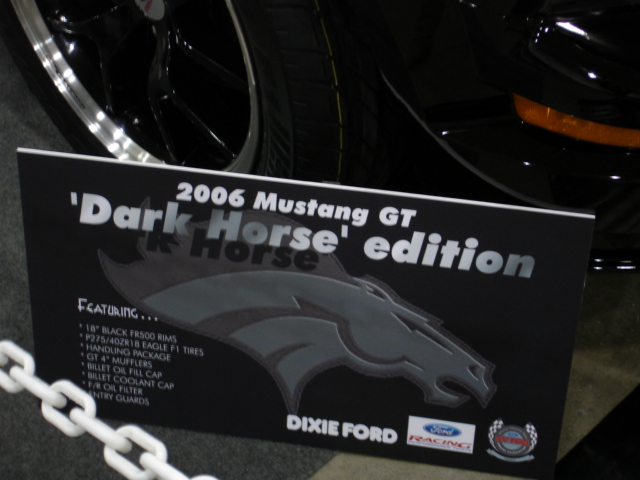 2006 Mustang GT 'Dark Horse' edition display sign listing featured upgrades from Dixie Ford