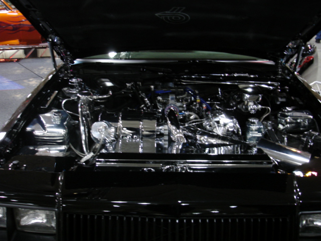 Black engine bay with chrome components and exposed engine