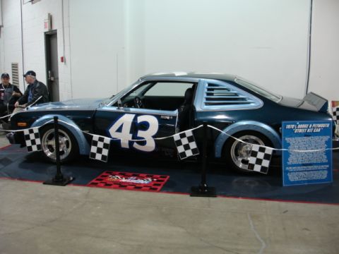 1981 Ford Mustang - This race car features a prominent number 43 on its side and a blue informational placard next to it.